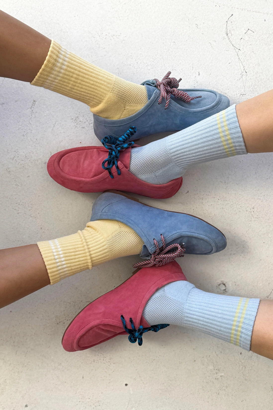 Colorful shoes and socks on a light background
