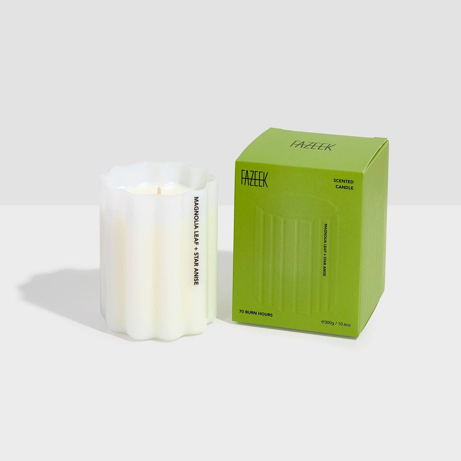 White candle with a green box on a white background