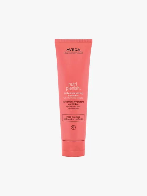 A tube of Aveda Nutriplenish Daily Moisturizing Treatment in a vibrant coral pink color, shown against a plain light gray background.