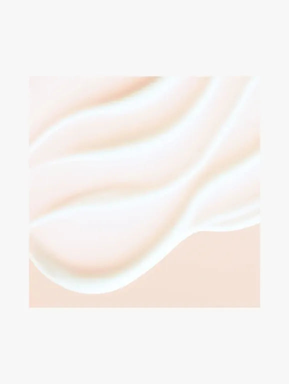 A close-up of a smooth, creamy off-white texture with soft wavy contours on a pale peach-beige background.