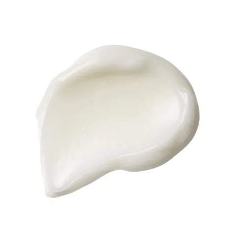 A dollop of thick, creamy white cosmetic cream or lotion on a solid white background.