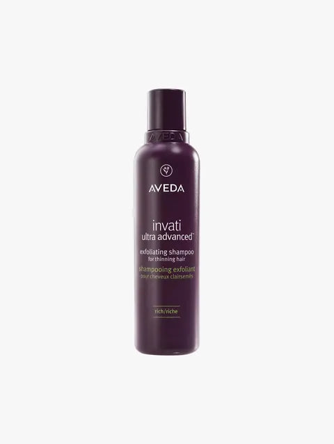 A bottle of Aveda Invati Ultra Advanced Inducing Shampoo for thinning hair, shown on a light gray background.