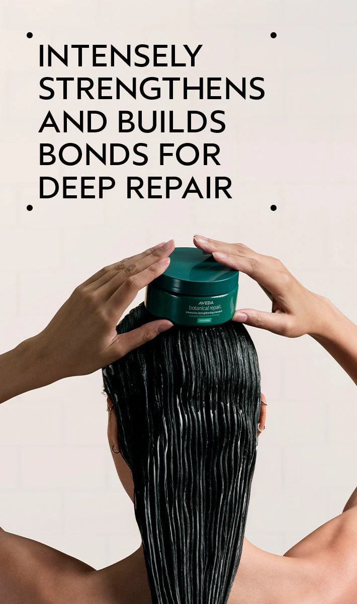 Person applying hair product to long hair with text about deep repair.