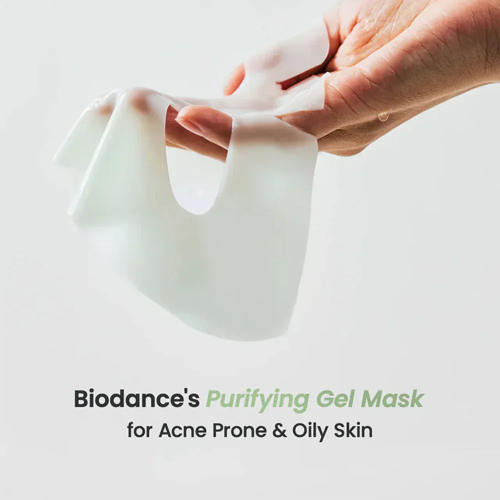 Hand holding a Biodance Purifying Gel Mask against a light background