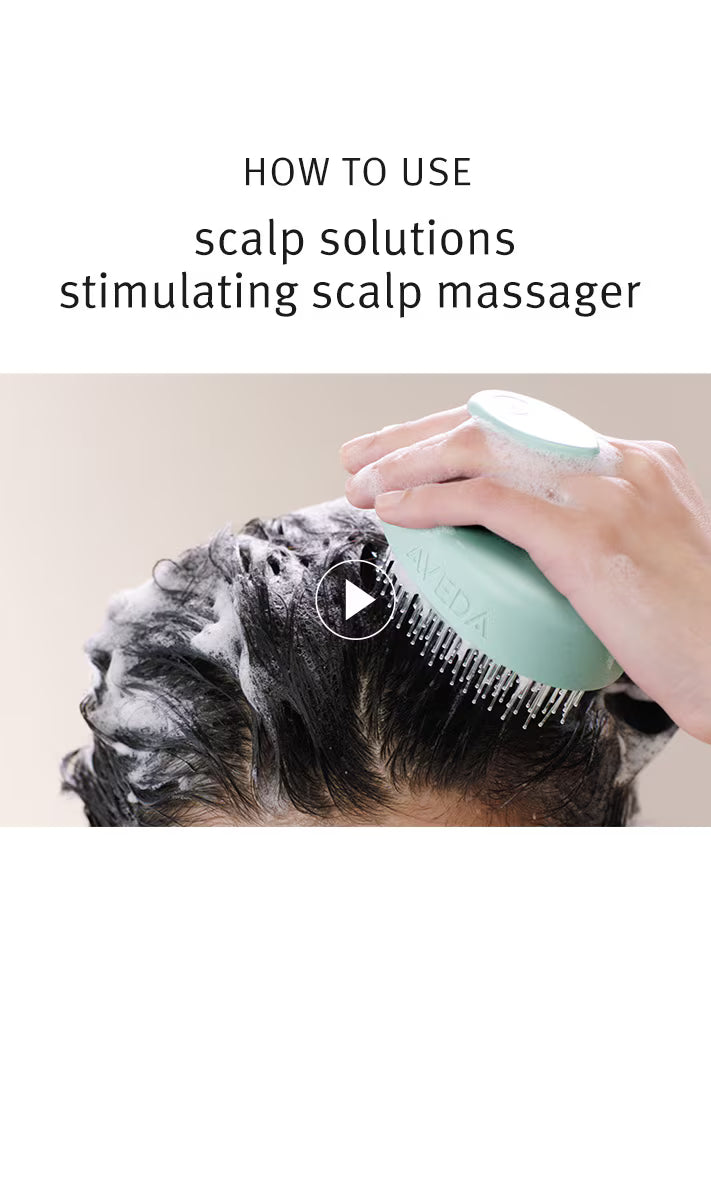 Person using a scalp massager with text on how to use scalp solutions.