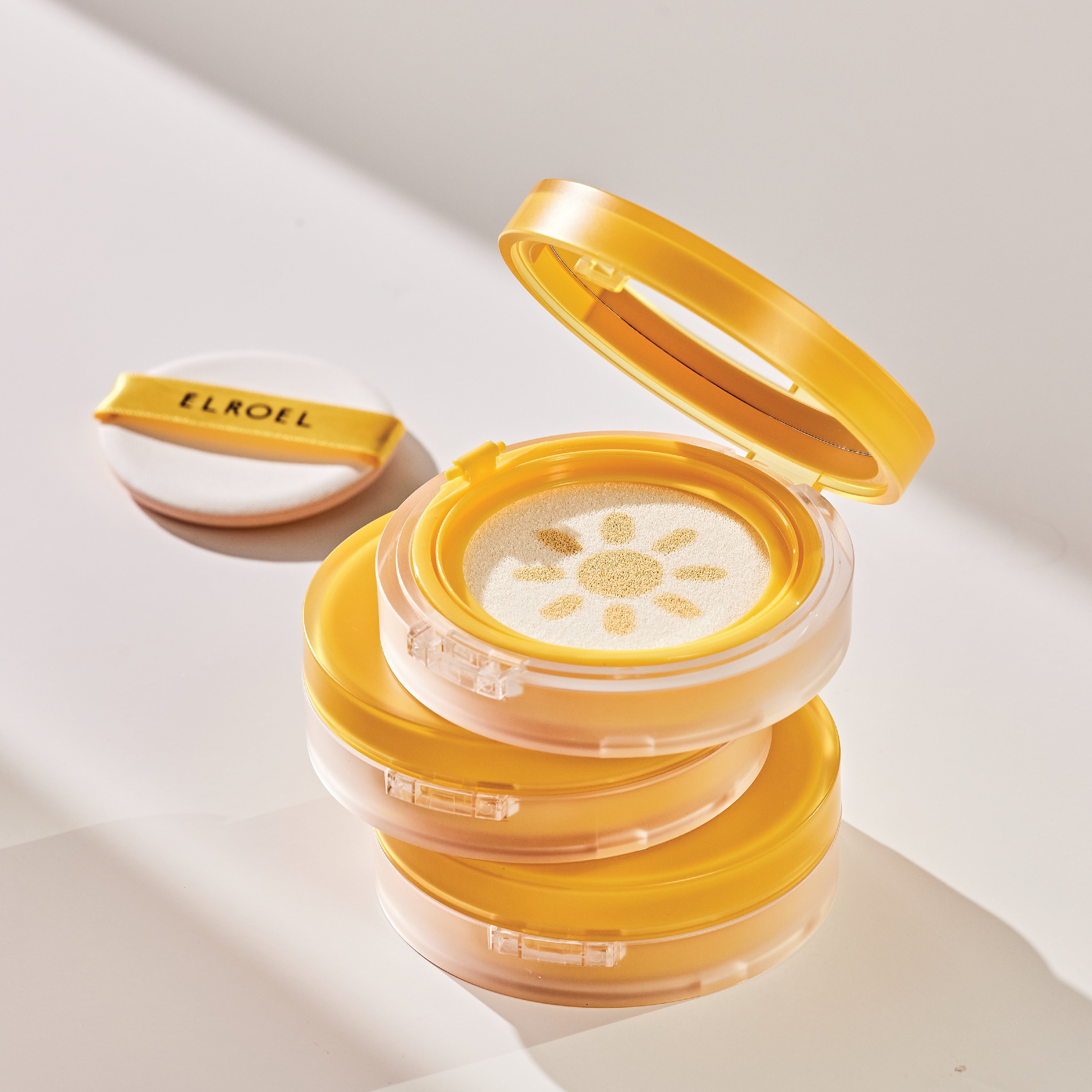 Elroel Yellow compact cushion case with a sun design 