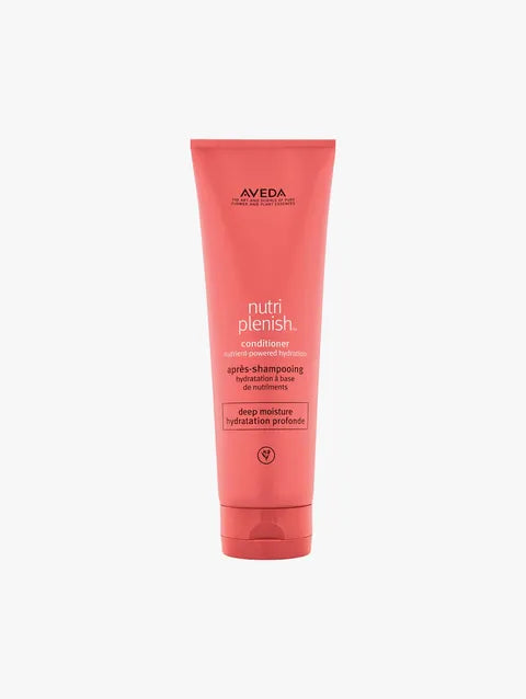 A tube of Aveda Nutri Plenish Conditioner on a light gray background.