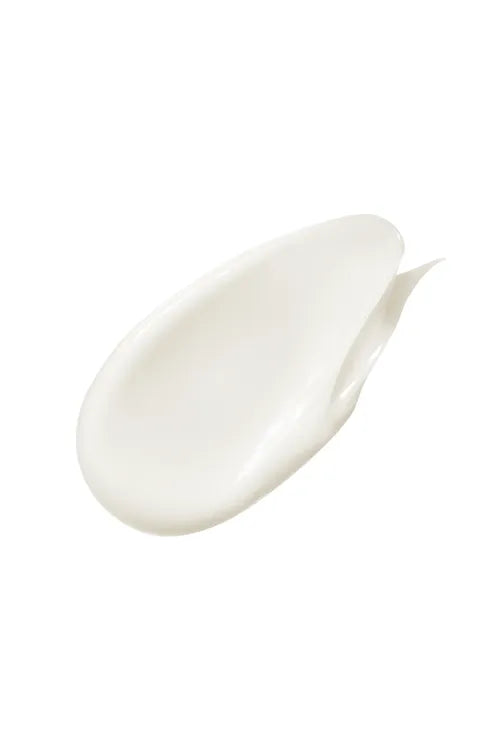 A smooth, glossy smear of thick white cream or lotion on a solid white background.
