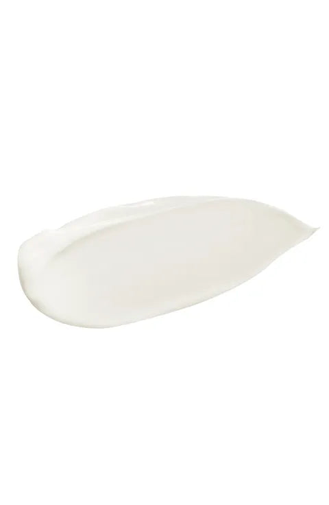 A thick, creamy white swatch of cosmetic cream or lotion on a solid white background.