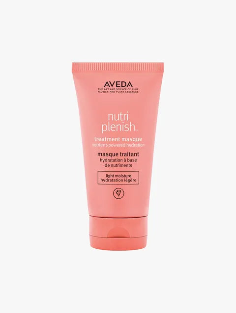 A tube of Aveda Nutriplenish treatment masque in a soft coral pink color, shown against a plain light gray background.