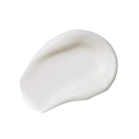 A smooth, creamy white product smear, likely a cream or lotion texture, shown on a solid white background.