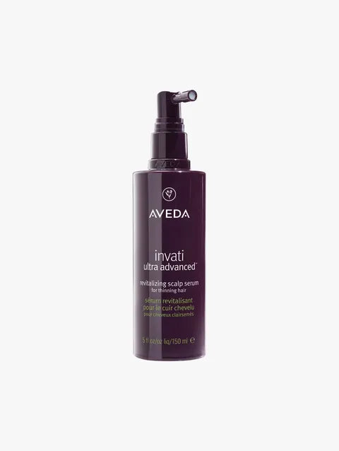 A bottle of Aveda Invati Ultra Advanced Revitalizing Scalp Serum with a dark purple pump dispenser, centered on a light gray background.