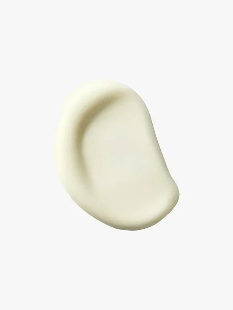A smooth, teardrop-shaped cream swatch in a warm off-white or cream color, centered on a solid white background.