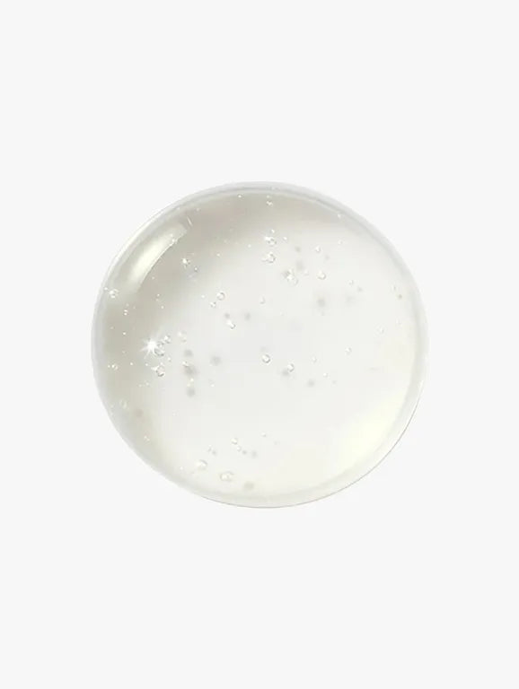 Clear glass gemstone with embedded small stones on a white background