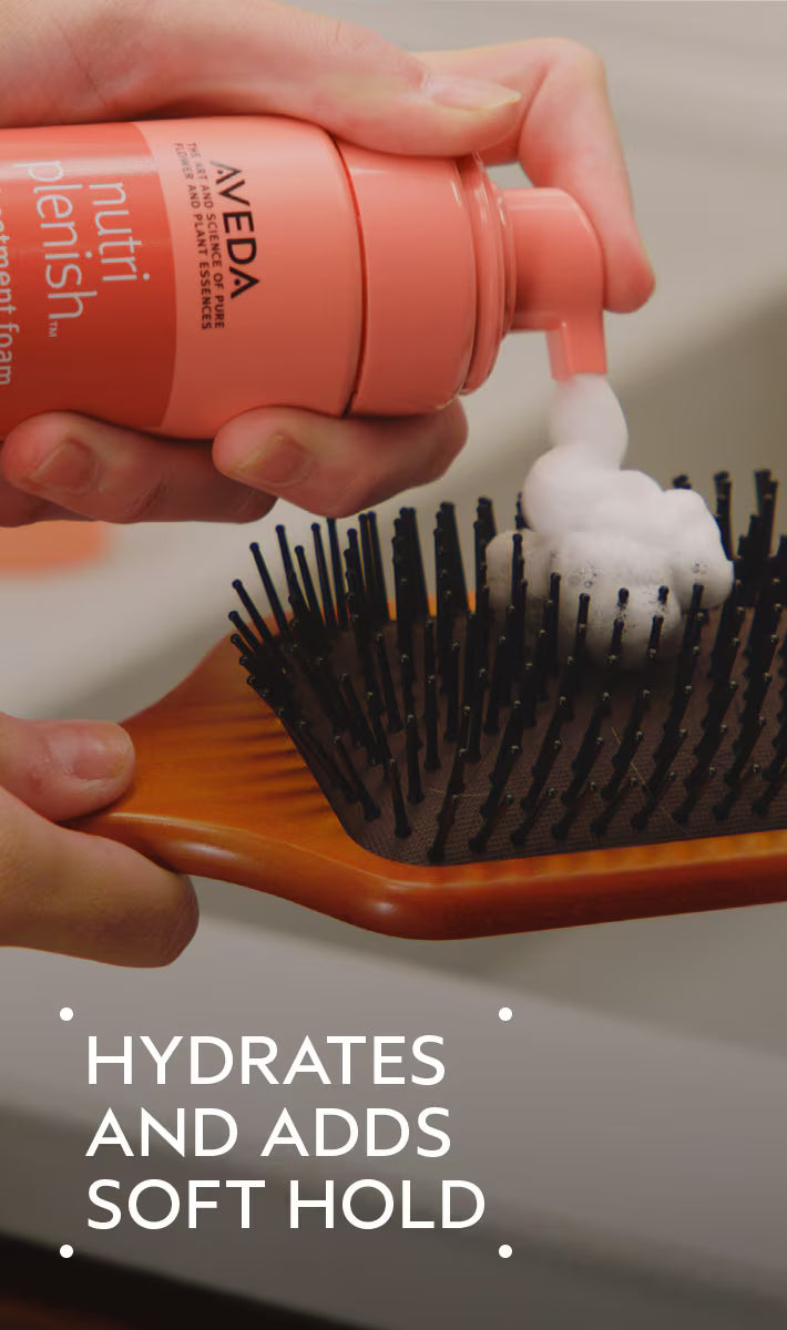 Aveda hair product being applied to a brush with text 'Hydrates and adds soft hold'.