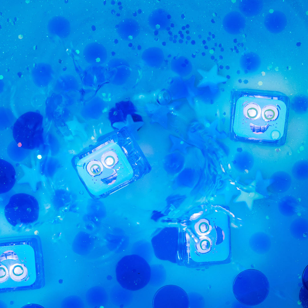 Blue toy figures with smiling faces in a water-like texture